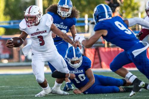 Chris Detrick  |  The Salt Lake Tribune
Bingham's Tongi Langi (10) tackles Herriman's Noah Vaea (3) during the game at Bingham High School Friday August 26, 2016.