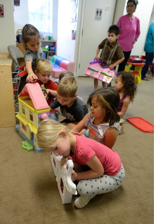 Francisco Kjolseth | The Salt Lake Tribune
Kids read books at the KidStart Daycare and Child Development Center in Midvale. The Family Support Center operates a multi-faceted program for single homeless mothers, which includes day-care facilities and lodgings to help them get back on their feet.