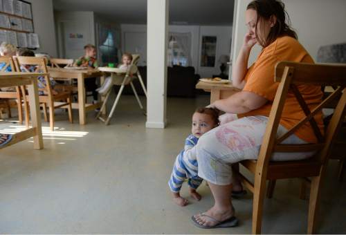 Francisco Kjolseth | The Salt Lake Tribune
Rebecca Blackburn watches another mother's child at a Phase 1 housing unit in Midvale where multiple single mothers share a communal kitchen as part of a program known as LifeStart. The a multi-faceted program for single homeless mothers, which includes day-care facilities and lodgings helps single parents get back on their feet.
