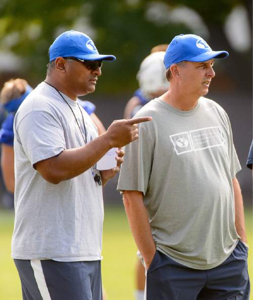 Trent Nelson  |  The Salt Lake Tribune
New coach Kalani Sitake oversees his first BYU fall camp practice, Friday August 5, 2016 in Provo. At right is offensive coordinator Ty Detmer.