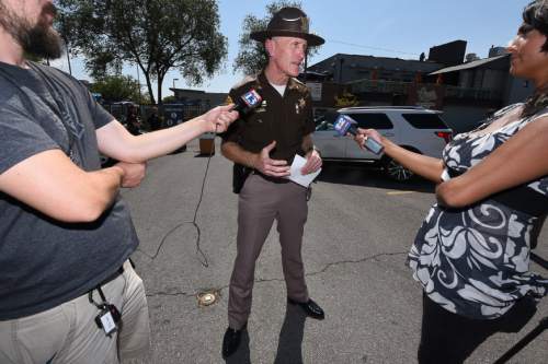 Francisco Kjolseth | The Salt Lake Tribune
Colonel Michael Rapich of the Utah Highway Patrol talks about a partnership with Uber to provide discounted rides over Labor Day weekend, in hopes of discouraging drinking and driving. Law enforcement and Uber drivers gathered for the press event in front of Gracie's Bar in Salt Lake on Tuesday, Aug. 30, 2016, to encourage people to have a plan before they drink.