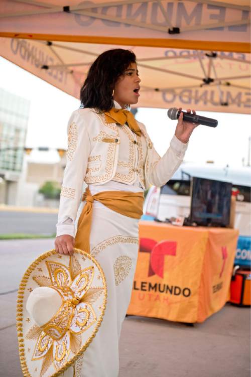 Lennie Mahler  |  The Salt Lake Tribune

Lluvia Macias performs music by Mexican singer-songwriter Juan Gabriel, who died of a heart attack Aug. 28. Telemundo 10 Utah hosted the vigil Monday, Aug. 29, 2016, in front of Vivint Smart Home Arena, where Gabriel was scheduled to perform Oct. 7.