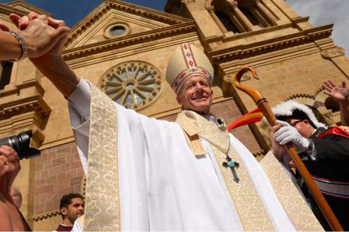 Leah Hogsten  |  The Salt Lake Tribune
The 12th Archbishop of Santa Fe John C. Wester is greeted by parishioners outside the cathedral after his mass installation, Thursday, June 4, 2015 at the Cathedral Basilica of St. Francis of Assisi in New Mexico.