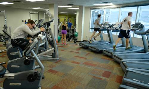 Francisco Kjolseth | The Salt Lake Tribune
Employees of CHG Healthcare Services near Big Cottonwood Canyon exercise in the Fitness Center.