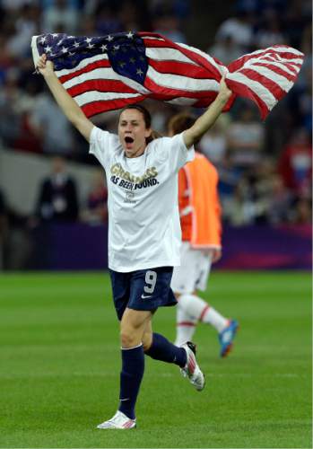 FILE - In this Aug. 9, 2012, file photo, United States' Heather O'Reilly celebrates after winning the women's soccer gold medal match against Japan at the 2012 Summer Olympics,  in London.  U.S. women's national team midfielder Heather O'Reilly has announced her retirement from international soccer after a 15-year run with the team.
O'Reilly will play her final international match with the team on Sept. 15 against Thailand in Columbus, Ohio. (AP Photo/Ben Curtis, File)
