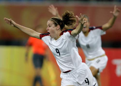 FILE - In this Aug. 12, 2008, file photo, USA's Heather O'Reill, celebrates after scoring against New Zealand during their women's Group G, first round soccer match at the Beijing 2008 Olympics in Shenyang, northeastern China's Liaoning province. U.S. women's national team midfielder Heather O'Reilly has announced her retirement from international soccer after a 15-year run with the team. O'Reilly will play her final international match with the team on Sept. 15 against Thailand in Columbus, Ohio.(AP Photo/Martin Mejia)