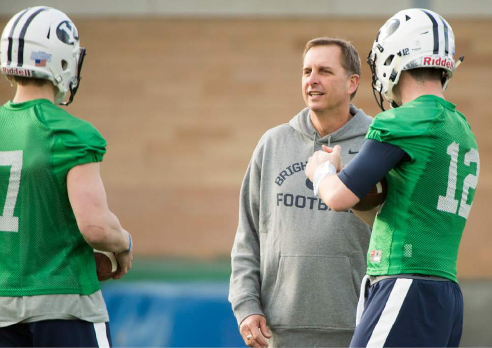 Rick Egan  |  The Salt Lake Tribune

BYU quarterback coach Ty Detmer talks with Beau Hoge (7) and Tanner Mangum (12) on the second day of spring practice, in Provo, Thursday, March 3, 2016.