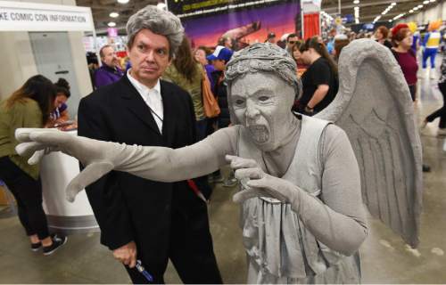 Francisco Kjolseth | The Salt Lake Tribune
Harold Weir of Lyndon, dressed as the 12th Doctor, is followed by a creepy Weeping Angel, played by his wife Roxanne, during day two of the 2016 Salt Lake Comic Con in Salt Lake City on Friday, Sept. 2, 2016.