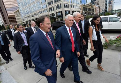 Scott Sommerdorf   |  The Salt Lake Tribune  
Utah Governor Gary Herbert, Indiana Governor Mike Pence, and U.S. Senator Orrin Hatch walk together as a tour of Temple Square begins, Thursday, September 1, 2016.
