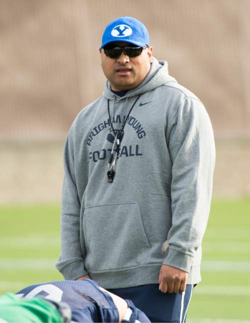 Rick Egan  |  The Salt Lake Tribune

BYU head coach Kalani Sitake watches the Cougars work out on the second day of spring practice, in Provo, Thursday, March 3, 2016.