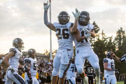 Chris Detrick  |  The Salt Lake Tribune
Corner Canyon's Jason Adams (26) and Corner Canyon's David Grostic (11) celebrate Adams' touchdown during the game at Roy High School Friday September 2, 2016. Corner Canyon defeated Roy 36-6.