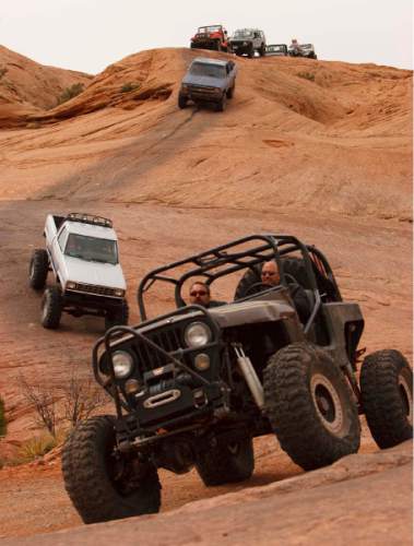 Trent Nelson  |  Tribune file photo
Jeeps and 4x4's on the Hell's Revenge 4x4 Trail, as thousands of Jeeps descended on the trails surrounding Moab for the annual Easter Jeep Safari  in 2009.