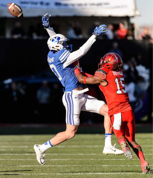 Trent Nelson  |  The Salt Lake Tribune
Brigham Young Cougars wide receiver Mitch Mathews (10) can't quite pull in the pass, with Utah Utes defensive back Dominique Hatfield (15) defending, as Utah faces BYU in the Royal Purple Las Vegas Bowl, NCAA football at Sam Boyd Stadium in Las Vegas, Saturday December 19, 2015.