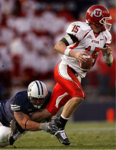 Trent Nelson  |  The Salt Lake Tribune
BYU's Steve Fifita sacks Utah quarterback Brett Ratliff. BYU vs. Utah college football Saturday in Provo, 2005.