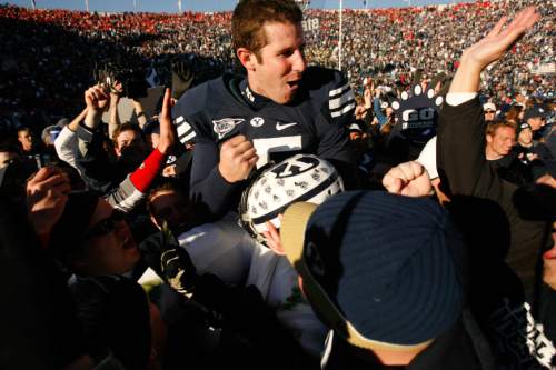 Trent Nelson  |  The Salt Lake Tribune
BYU fans hold Brigham Young quarterback Max Hall (15) on their shoulders, celebrating victory as BYU defeats the University of Utah 17-10 in college football action Saturday at BYU's Lavell Edward Stadium in 2007.