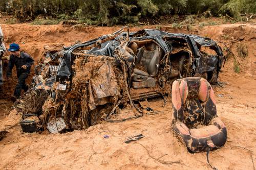 Trent Nelson  |  The Salt Lake Tribune
A car seat on the ground at the spot in a Hildale wash Tuesday September 15, 2015 where two vehicles ended up after being washed away in a flash flood. Nine people died (with four still missing) when the SUV and van were washed off a road during a flash flood in this polygamous Utah-Arizona border community.