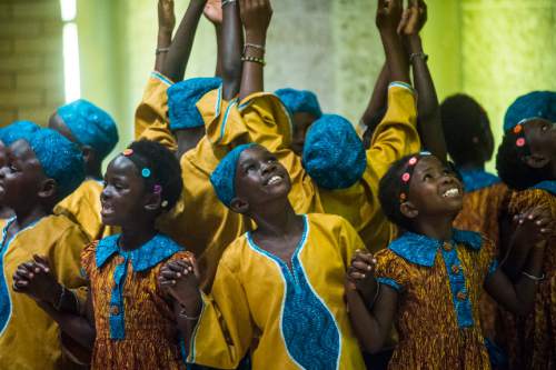 Chris Detrick  |  The Salt Lake Tribune
The African Children's Choir performs at Cottonwood Presbyterian Church Sunday September 4, 2016. The program featured well-loved children's songs, traditional
Spirituals and Gospel favorites. Music for Life (The parent organization for The African Children's Choir) works in seven African countries such as, Uganda, Kenya, Rwanda, Sudan, Nigeria, Ghana and South Africa. Music for Life has educated over 52,000 children and impacted the lives of over 100,000 people through its relief and development programs during its history. 
The African Children's Choir has had the privilege to perform before presidents, heads of state and most recently the Queen of England, Queen Elizabeth II, for her diamond jubilee. The Choir has also had
the honor of singing alongside artists such as Paul McCartney, Annie Lennox, Keith Urban, Mariah Carey, Michael W. Smith, and other performers.