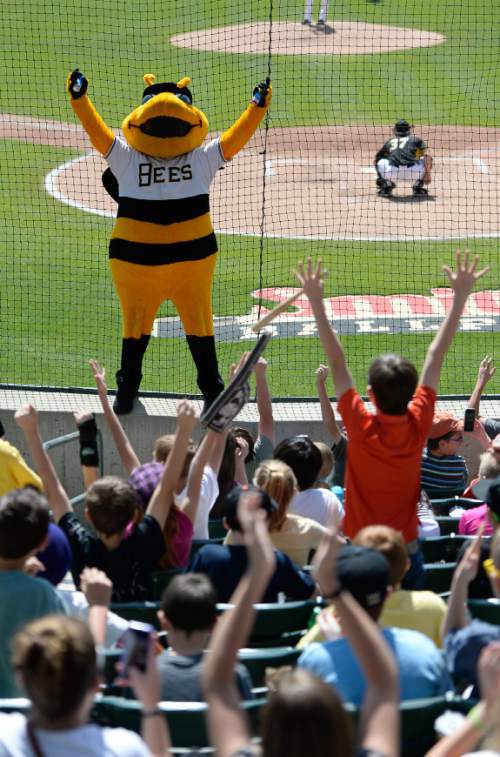 Francisco Kjolseth  |  The Salt Lake Tribune 
Bumble gets the mostly young crowd to rise up to cheer on the Bees on Monday, May 11, 2015. The Salt Lake Bees hosted their annual weekday morning game, with 13,000 fifth and sixth graders at Smith's Ballpark.