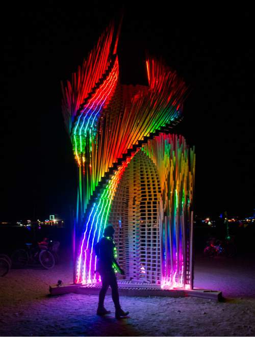 Rick Egan  |  The Salt Lake Tribune

"Tangential Dreams" by Arthur Mamou-Mani, London, United Kingdom,at the Burning Man Festival, in the Black Rock Desert, 100 miles north of Reno, NV, Friday, September 2, 2016.
Tangential Dreams is a climbable tower made from off-the-shelf timber and digitally designed via algorithmic rules. The pieces are lit by LED strips during the night.