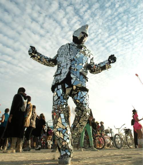 Rick Egan  |  The Salt Lake Tribune

"Steve the Man in the Mirror" from Las Vegas, dancers in his mirror suit, at the Burning Man Festival, in the Black Rock Desert 100 miles north of Reno Nevada, Saturday, September 3, 2016.