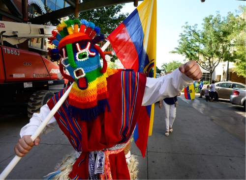 Scott Sommerdorf   |  The Salt Lake Tribune  
The group representing Ecuador dances down Rio Grande St. during the first Annual Hispanic Heritage Parade & Street Festival at The Gateway on Saturday.
