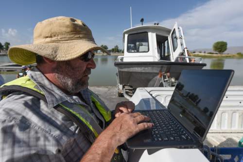 Francisco Kjolseth | The Salt Lake Tribune
Bryan Downing, a research hydrologist loads a mapping program as U.S. Geological Survey scientists get ready to conduct an experimental study on Utah lake on Wednesday, Aug. 10, 2016, to gain a better understanding of nutrient levels, which could help in understanding how to best manage algal bloom outbreaks. The pilot project is using new technology to measure the distribution, occurrence, and concentration of nutrients in in both Utah Lake and Gilbert Bay of the Great Salt Lake.