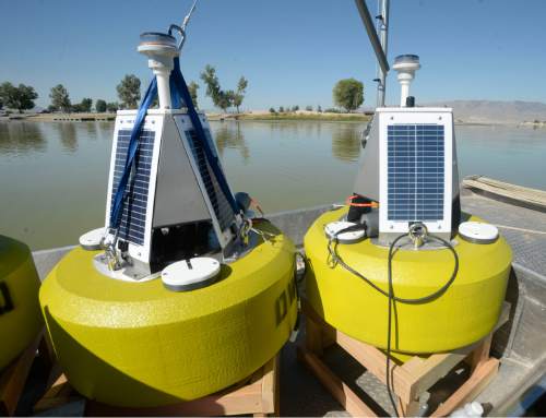 Al Hartmann  |  The Salt Lake Tribune
The Utah Division of Water Quality is installing three solar buoys housing probes called sondes in Utah Lake that should be able to give them a warning when nutrients are building up to the point that they'll have another massive algal bloom like the one in July.