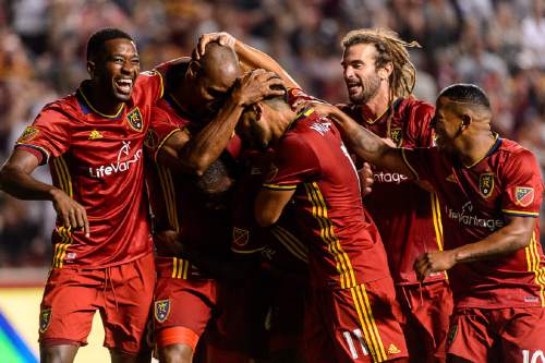 Trent Nelson  |  The Salt Lake Tribune
Real Salt Lake players swarm on defender Jamison Olave (4) after his goal against FC Dallas at Rio Tinto Stadium in Sandy, Saturday August 20, 2016.