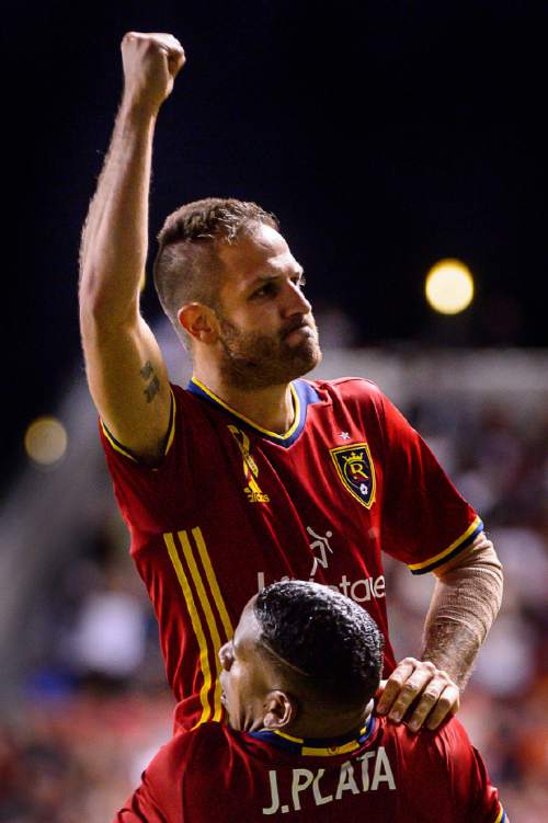 Trent Nelson  |  The Salt Lake Tribune
Real Salt Lake forward Juan Martinez (7) celebrates his goal in stoppage time to tie the game 3-3 as Real Salt Lake hosts the Los Angeles Galaxy, MLS soccer at Rio Tinto Stadium in Sandy, Wednesday September 7, 2016. Holding Martinez is Real Salt Lake forward Joao Plata (10).