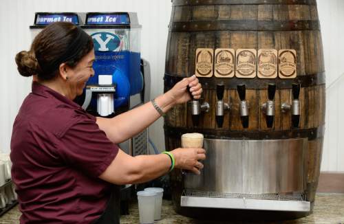 Francisco Kjolseth | The Salt Lake Tribune
Dina Brown, an 18-year employee of Chuck-A-Rama, fills up a frothy cup of root beer at the popular eatery, which is celebrating its 50th anniversary on Wednesday.
