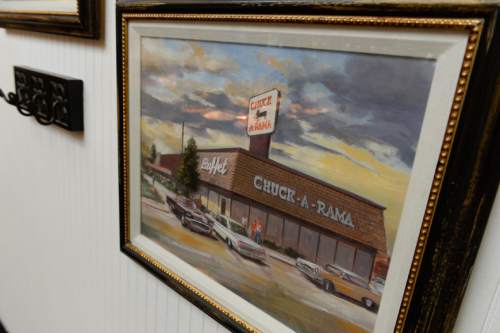 Francisco Kjolseth | The Salt Lake Tribune
A painting on the wall depicts the original Chuck-A-Rama restaurant in Salt Lake City at the original location near 700 East and 400 South. The Utah-based restaurant chain is celebrating its 50th anniversary on Wednesday.