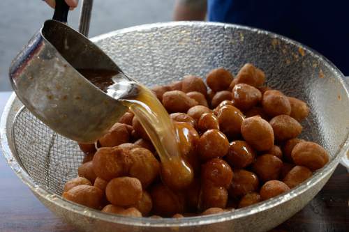Scott Sommerdorf   |  The Salt Lake Tribune
Loukoumathes, deep-fried dough covered in honey, is one of the favorite foods at Salt Lake City's annual Greek Festival, which celebrates 41 years this Friday-Sunday.