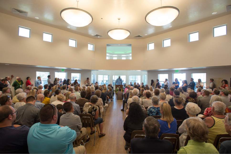 Rick Egan  |   Tribune file photo

Johnnie Moore tells his story to a packed house before the ribbon cutting of the new Lantern House homeless shelter in Ogden, Tuesday, June 16, 2015. The shelter has a capacity around 300 beds -- about the size of the ones proposed for Salt Lake City. Several members of the Salt Lake City Council think the 250-300 bed shelters are too big and would overwhelm any neighborhood in which they were located.