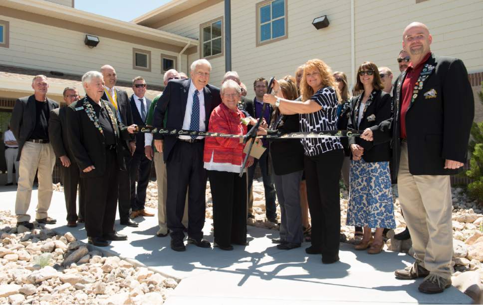 Rick Egan  |   Tribune file photo
The ribbon is cut  during the June 2015 opening ceremony of the new Lantern House homeless shelter in Ogden. The Lantern House's capacity of around 300 beds is about the size of two as-yet-to-be-sited shelters in Salt Lake City that are generating concerns from Salt Lake City Council members for being too large for neighborhoods.