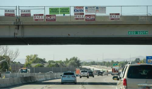 Francisco Kjolseth | The Salt Lake Tribune
During a recent morning drive along I-215 in Salt Lake, one can see many campaign signs popping up on freeway bridges and right of way's, which are illegal according to UDOT.