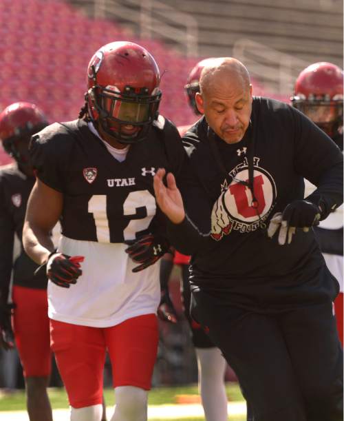 Leah Hogsten  |  The Salt Lake Tribune
Guy Holliday, University of Utah football receivers coach, runs through drills with players Saturday, March 26, 2016 at Rice-Eccles Stadium. Holliday, 50, is the only newcomer to Utah's football coaching staff this year and takes over a unit with less proven talent and experience as the Utes lose their top three receiving yard leaders and replace quarterback Travis Wilson.