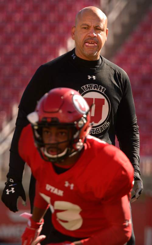 Leah Hogsten  |  The Salt Lake Tribune
Guy Holliday, University of Utah football receivers coach, runs through drills with players Saturday, March 26, 2016 at Rice-Eccles Stadium. Holliday, 50, is the only newcomer to Utah's football coaching staff this year and takes over a unit with less proven talent and experience as the Utes lose their top three receiving yard leaders and replace quarterback Travis Wilson.