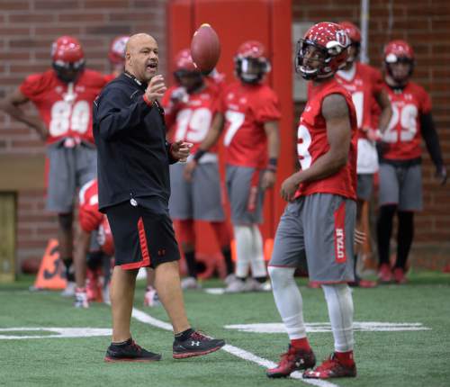 Francisco Kjolseth | The Salt Lake Tribune
University of Utah wide receiver coach Guy Holliday encourages his the team running drills as the team kicks off opening day of spring practice on Tuesday, March 22, 2016.