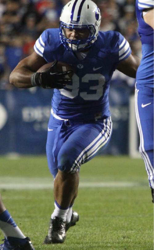 Rick Egan  | The Salt Lake Tribune 

Brigham Young Cougars running back Paul Lasike (33) runs the ball, as BYU faced The University of Utah, at Lavell Edwards Stadium, Saturday, September 21, 2013.