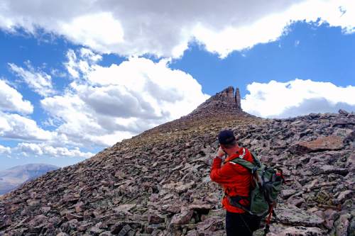 Lennie Mahler  |  The Salt Lake Tribune

Peter Wagner looks back for a photo while descending Kings Peak. Tuesday, Sept. 6, 2016.