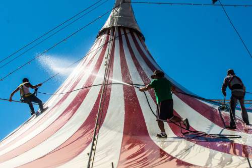 Chris Detrick  |  The Salt Lake Tribune
Ruden Caballer, Douglas Ranols and Rodofo Guetiro  wash the top of the Big Top Circus Spectacular at the Utah State Fairpark Wednesday September 7, 2016. The Utah State Fair runs September 8 – 18 at the Utah State Fairpark.