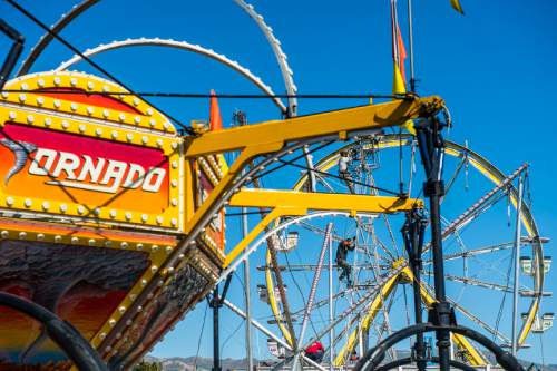 Chris Detrick  |  The Salt Lake Tribune
Workers set up lights at the Utah State Fairpark Wednesday September 7, 2016. The Utah State Fair runs September 8 – 18 at the Utah State Fairpark.