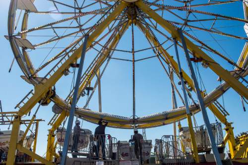 Chris Detrick  |  The Salt Lake Tribune
Workers set up the Thomas Carnival Century Wheel at the Utah State Fairpark Wednesday September 7, 2016. The Utah State Fair runs September 8 – 18 at the Utah State Fairpark.