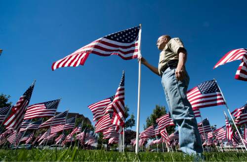 Rick Egan  |  The Salt Lake Tribune

Ron Kaiser, Pleasant Grove, reads about one of the victims of the Sept.11 terrorist attacks, on one of the flags in the Healing Field, south of Sandy City Hall at 10000 South Centennial Parkway Sandy City.  The Healing Field display contains more than 3,000 American flags in remembrance of the lives lost in the Sept. 11, 2001, terrorist attacks. Friday, September 9, 2016.