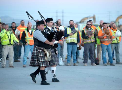 Rick Egan  |  The Salt Lake Tribune

Bagpipes play as workers for the Salt Lake Airport rebuild project gather for a  9/11 remembrance ceremony honoring first responders, at the Salt Lake Airport, Friday, September 9, 2016.