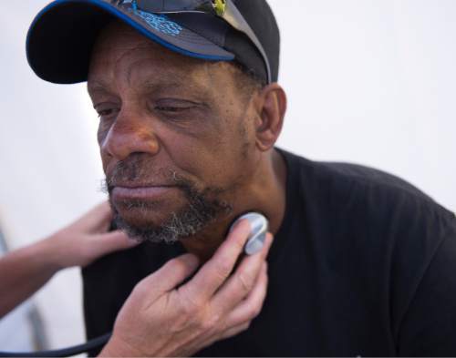 Leah Hogsten  |  The Salt Lake Tribune
Homeless Navy veteran Chris Lowe was told he needs to seek medical attention for high blood pressure and was signed to a primary care physician at the Utah VA Hospital.  Homeless veterans receive a wide array of services ranging from health screenings to information on transitional housing to employment services, September 10, 2016 at the Homeless Veteran Stand Down at the Gallivan Center.