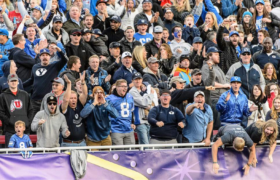 Trent Nelson  |  The Salt Lake Tribune
BYU fans get amped in the fourth quarter after a reception by Brigham Young Cougars wide receiver Devon Blackmon (19) as Utah faces BYU in the Royal Purple Las Vegas Bowl, NCAA football at Sam Boyd Stadium in Las Vegas, Saturday December 19, 2015.