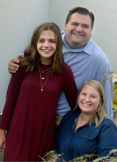 Scott Sommerdorf   |  The Salt Lake Tribune  
Ally Smith, her father Aaron Smith, and his wife Marissa, pose for a photo, Wednesday, August 31, 2016.