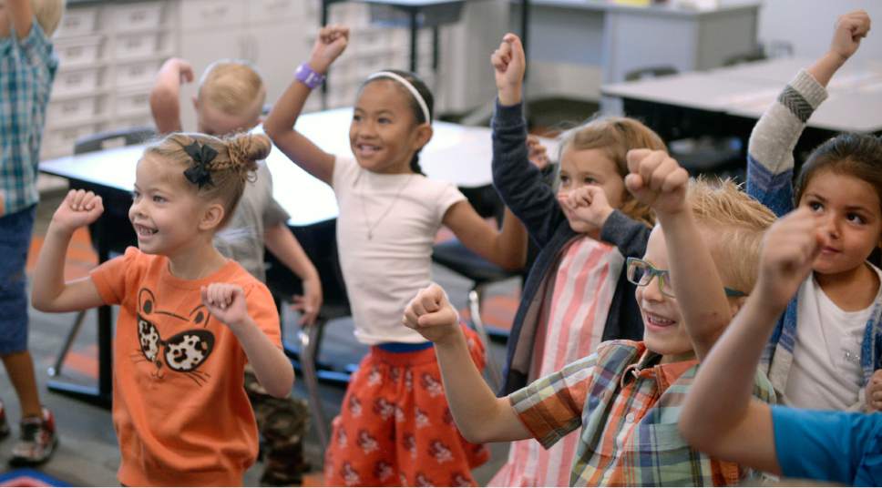 Al Hartmann  |  The Salt Lake Tribune
First graders in Jackie Marquwez' class learn a new  dance called "GoNoodle" to get their wiggles out to help break up their study at the brand new Butler Elementary in Cotonwood Heights Wenesday March 25.  It is one of hundreds of schools that opened Wednesday as students gear up for the 2016-2017 school year.