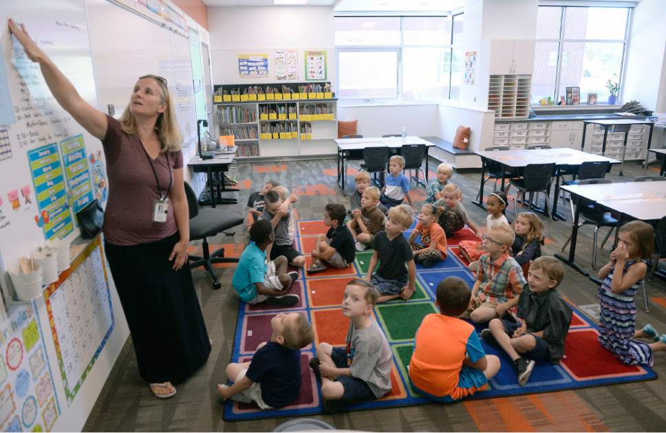 Al Hartmann  |  The Salt Lake Tribune
First grade teacher Jackie Marquez gathers her new students to go over some basic rules, including bathroom protocol at the brand new Butler Elementary in Cotonwood Heights Wenesday March 25.  It is one of hundreds of schools that opened Wednesday as students gear up for the 2016-2017 school year.